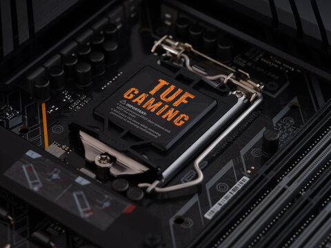 Tambov, Russian Federation - April 04, 2022 Asus TUF Gaming Motherboard. Low key. Close up.