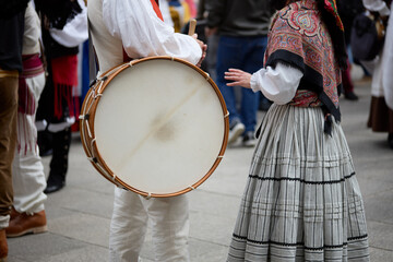 Man in period dress holding a drum at the popular festival of the reconquest of the city of Vigo,...
