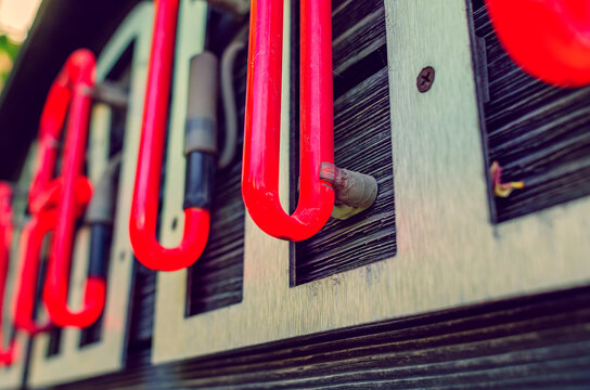 Neon sign up close. Neon letters. Fashionable style.