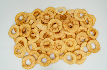 Round slices of dried apples on a white background. Apple chips.