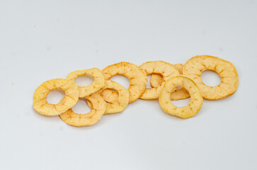 Apple chips. Useful dried fruits for a light snack. White background.
