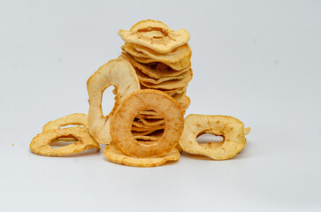 Hill of dried thin apple slices. White background. Healthy Eating.