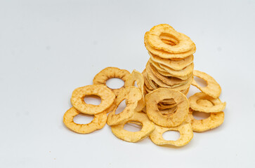 Hill of dried thin apple slices. White background. Healthy Eating.