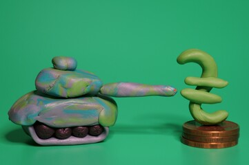 A toy tank and a hryvnia symbol on a green background.