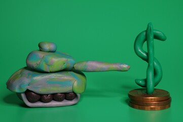 A toy tank and a dollar symbol on a green background.