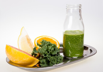 Healthy smoothie jar, citrus fruits and cale.  