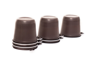 Photo of brown plastic disposable cups isolated on white background with copy space for text