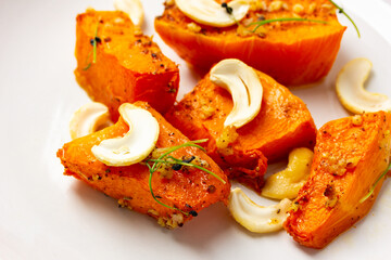 Fried baked pumpkin with spices, olive oil, herbs.
