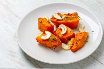 Fried baked pumpkin with spices, olive oil, herbs.