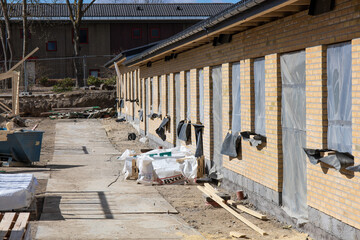 Herlev, Denmark - April 3, 2022: New house under construction and building materials. High quality photo