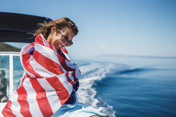 Woman Wrapped In US National Flag Spending Day On Private Yacht