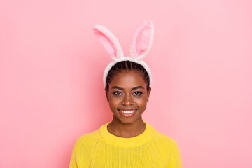 Photo of pretty positive lady bunny ears headband toothy smile isolated on pink color background