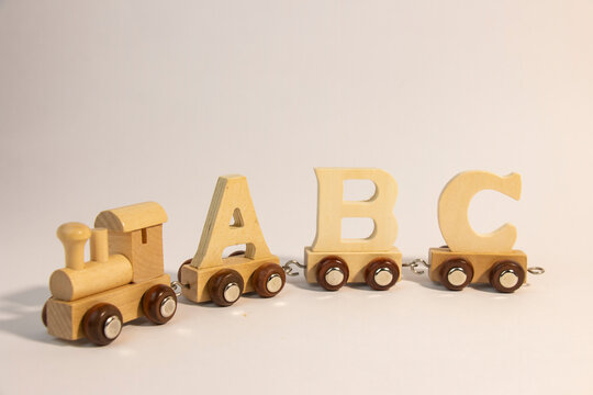 wooden letters A,B,C, letters train alphabet. Preschool education, learning to read, concept of preschool and children's games