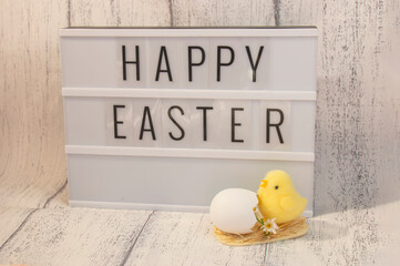 Stylish lightbox text frame with happy easter inscription. chick yellow easter symbol.