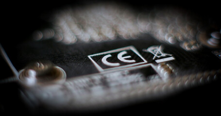 CE logo on the surface of the electronic board - obrazy, fototapety, plakaty