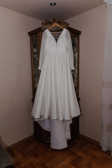 White dress of the bride on a hanger. Wedding