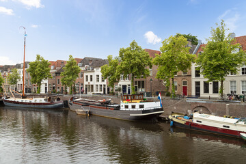 Old harbor with historic canal houses in the city of Den Bosch.