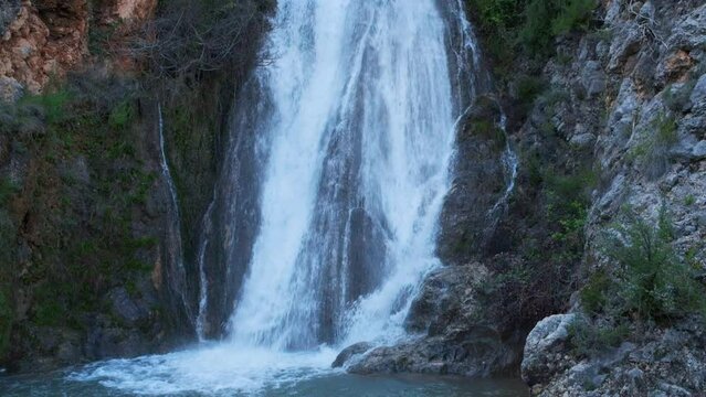 Beautiful large waterfall in a slow motion.