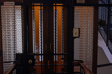 Antique wooden Elevator in a Metal Shaft
