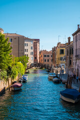 Fototapeta na wymiar VENICE, ITALY - August 27, 2021: Scenic view of Venice empty canals during daylight.