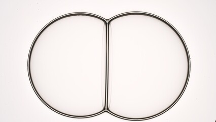 Two big bubbles join each other creating a bubble cluster against light grey background | Skincare cosmetics with hyaluronic acid commercial