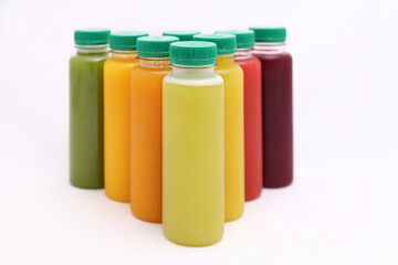 Fresh Fruit Juices in plastic Bottles isolated on white Background , copy space, mock up.