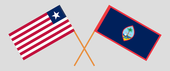 Crossed flags of Liberia and Guam. Official colors. Correct proportion