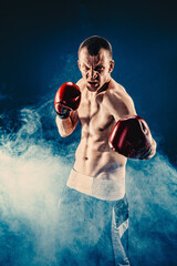 Sportsman boxer fighting on black background. Copy Space. Boxing sport concept