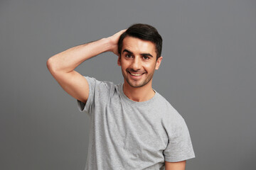 Obraz premium handsome man casual wear gray t-shirt fun hand gesture isolated background