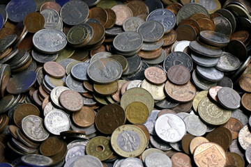 Close up of a collection of old coins kept at a roadside vendor's shop for sell