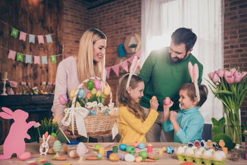Portrait of attractive cheerful family creative art hobby spending weekend free time fighting eggs at loft home indoors