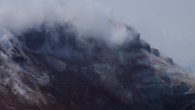 Caldera of Avachinsky stratovolcano, also known as Avacha Volcano. Swinging steam from hot geysers. Kamchatka Peninsula, Russia.