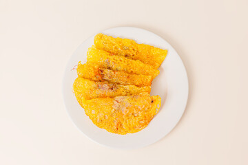 Banh xeo, Vietnamese Crêpes or Pancakes with pork, shrimp, onions, beasn sprouts inside, Vietnamese food isolated on white background. top view