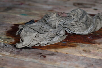 rag on a very dirty wooden table