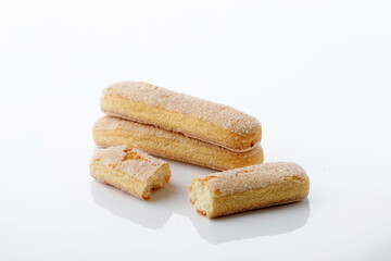 Fototapeta na wymiar Italian cookie savoiardi. Sweet biscuits. Sponge cookies tiramisu isolated on white background.