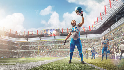 Joy in football. American football player celebrating victory at professional sports stadium during...