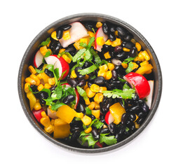 Bowl of Mexican vegetable salad with radish and black beans isolated on white background
