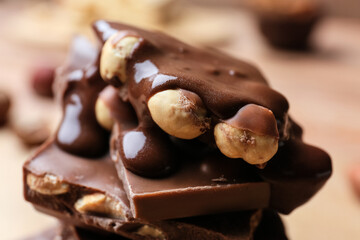 Pieces of tasty chocolate with nuts, closeup