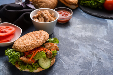Fresh doner kebab in bun on color background