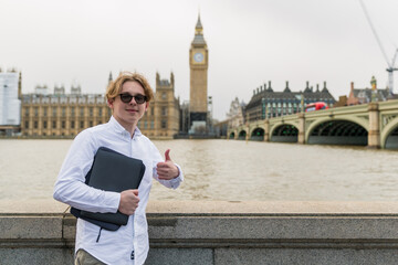 education, school, knowledge and people concept - picture of happy student boy  in white t-shirt ...