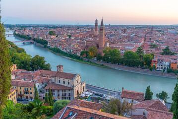 Sunset view of waterfront of the adige river in the italian city verona