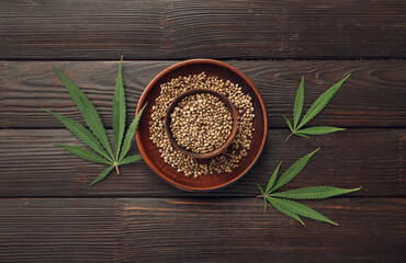 Hemp seeds on wooden background