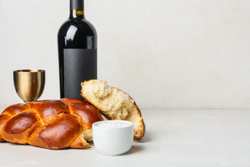 Traditional challah bread with wine on white background. Shabbat Shalom - obrazy, fototapety, plakaty
