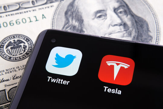 Twitter and Tesla apps seen on the corner of smartphone. Concept for Elon Musk buying shares of Twitter. Stafford, United Kingdom, March 4, 2022.
