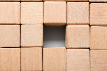 Texture made of many wooden cubes with one missing block in center