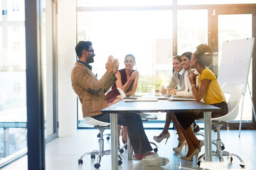 Weve got some great ideas to merge together. Shot of a diverse group of businesspeople having a...