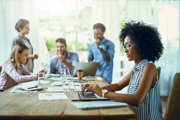 Put in the work and reap the rewards. Shot of young designers working in a modern office.