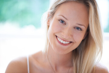 Feeling great about myself - Self-confidence. Cute young woman smiling happily at you.