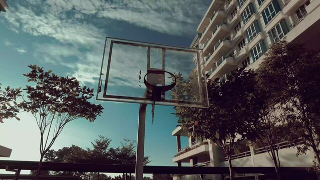 Sun Glare Shining Above The Basketball Court Low Angle Front Video In 4k.