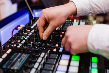 Hand of a deejay playing music